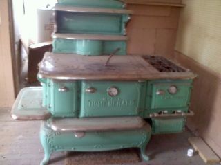 over a century old Home Herald gas stove