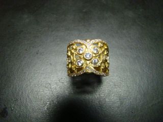 Very Regal 18K gold cigar band ring with diamonds