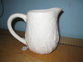 Antique white ceramic pitcher w Lily of the Valley floral embossing