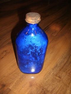 Antique BLUE GLASS Phillips Milk of Magnesia medicine bottle with cap.