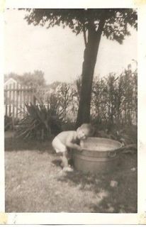Vintage 1950s Photograph   Baby Boy In Playing In Metal Wash Tub