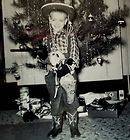 Vintage mid century photo 1957 Christmas morning boy in cowboy gun 