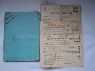 Collection of 4 War ration books with variety of stamps WWII