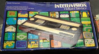 mattel intellivision console with 7 boxed games 