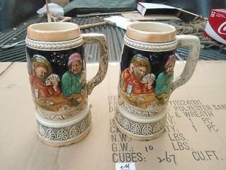 Matched Pair of Vintage Ceramic Relief Beer Steins w/Music Boxes 