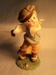For your consideration, a delightful little angel playing golf 