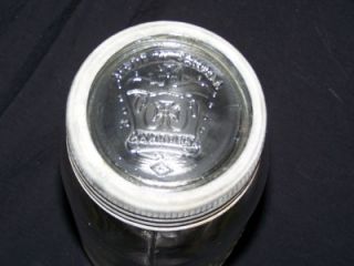   EMBOSSED ONE QUART CANNING JAR W/ GLASS EMBOSSED TOP AND ZINC RING