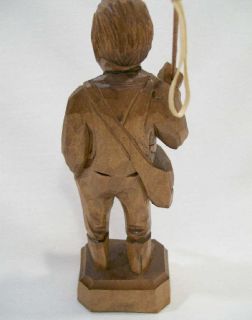 Old stock. Quebec carver signed Caron   Young man with fishing rod.