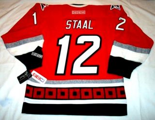 ERIC STAAL   size LARGE   with C   Carolina Hurricanes CCM 550 Jersey