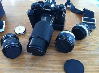 Canon A 1 with motor drive, three lenses (incl. macro), flash, battery