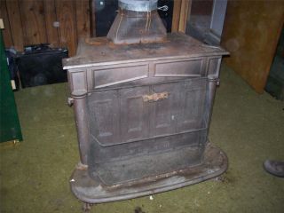 vtg Franklin wood burning cast iron stove w/ screen, stainless triple