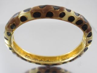 You are bidding on a KENNETH JAY LANE Giraffe Bangle Bracelet. This is