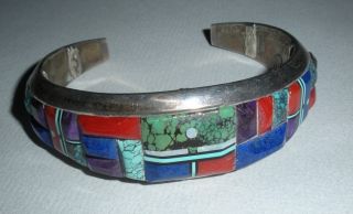 Zuni Artist Lloyd Tsalabutie Bracelet w Carved Stones
