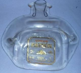 melted flat resposado patron tequila gold bottle