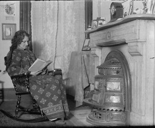 1914 photo Woman seated in front of coal stove, c.1914 Vintage Black
