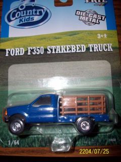 Ertl 1/64 blue ford f 350 stakebed pickup truck dually