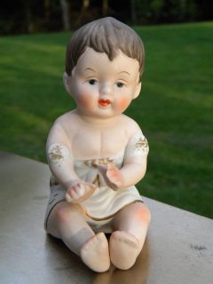 BABY DOLL FIGURE FIGURINE CHILD SITTING UP W/ WHITE OUTFIT GOLD DETAIL