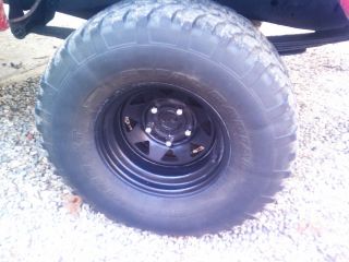 of 4 33x12 5 15 4x4 mud tires on black 10 steel rims FWD truck Wheels